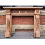 Antique carved Oak fire surround with carved detail featuring leaf swags,