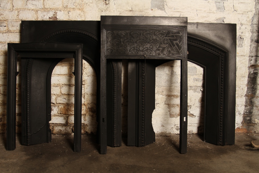 A lot of fire cast iron inserts, comprising 4 varying styles.