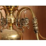 Antique polished brass 6 arm Flemish chandelier with male face detail H : 76 cm