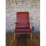 Mid Century faux red leather upholstered armchair with beech wood frame H: 90 W: 64 cm