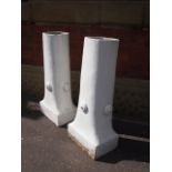 A pair of terracotta chimney pots painted white H : 84 cm W 34 cm