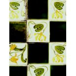 Set of seven Art Nouveau green and white water lily tiles 15 x 15 cm