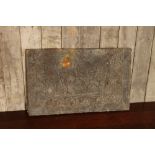 Antique brass panel with embossed image of fighting knights on horseback