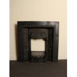 Victorian cast iron insert with decorative panels of a male and female figures with decorative