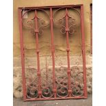An iron scrollwork design railing in red H: 90 W: 62 cm