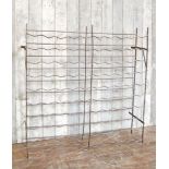 An antique French wrought iron wine rack, powder coated in a bronze finish , H : 107, L : 103 ,