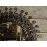 20thC brushed steel Moroccan mirror with compact swirl frame