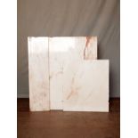 Four various sized pieces of marble