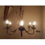 A six-branch wrought iron chandelier H : 85 cm