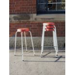 Mid century steel framed stool in white with faux red leather padded seat and white piping detail