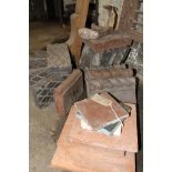An assortment of Victorian terracotta edging tiles, Victorian cast iron shoe last,