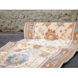 An antique style 3 piece carpet runner with geometric design L : 7500 x 700 cm