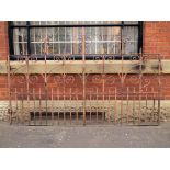 A pair of wrought iron driveway gates of arched design with spike tops H: 166 W: 268 cm