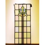 Coloured glass panel with tall floral detail on pastel chequered background H: 96 W: 39 cm