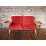 Mid Century beech sofa with red upholstered cushions and integrated side tables H: 75 L: 168