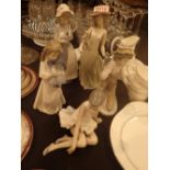 Six Nao figurines