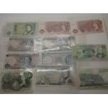 Thirteen British bank notes,