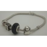 Sterling silver genuine Pandora bracelet with three genuine Pandora charms,