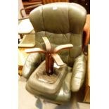 Green leather swivel base arm chair and matching footstool