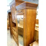 Large Victorian triple wardrobe with two single end wardrobes and central drawers and cupboard,