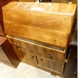 Vintage walnut bureau with fitted interior and two drawers over two cupboards