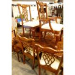 Quarter mahogany dropleaf dining table with extra leaf and six Sheraton style dining room chairs,