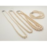 Three boxes of synthetic pearl necklaces