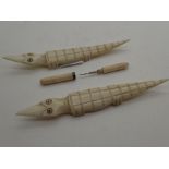 Antique ivory screw top tooth pick, L: 6 cm and Pair of Antique ethnic carved ivory crocodiles,