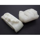 Two Chinese near white jade buckles, Qing Dynasty of rectangular form with slightly round ends,