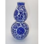 Chinese blue and white porcelain double gourd vase with scrolling lotus flower decoration,