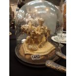 Glass dome containing boy with horse figurine