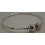 Sterling silver genuine Pandora bangle with one genuine sterling silver and gold Pandora charm,