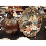 Large table top mirror with gesso frame and a globular vase