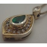 18 ct gold green stone and diamond pendant on a 18 ct gold chain, 5.