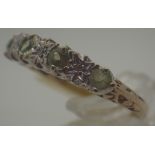 9 ct gold peridot and diamond half eternity ring,