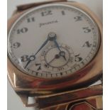 Helvetia 9 ct gold wristwatch on a plated expanding bracelet