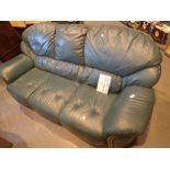 Three seat green leather settee