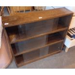 Antique oak three shelf bookcase with glass sliding doors,