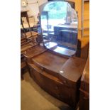 Vintage walnut dressing table with three short over two long drawers and a mirror back,