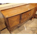 Large mahogany bowfront sideboard with two central drawers and two end cupboards,