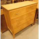 Attractive light oak four drawer chest of drawers