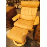 Beech framed tan leather arm chair on circular base with matching footstool