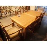 Large heavy pine rectangular extending dining table with six chairs including two carvers