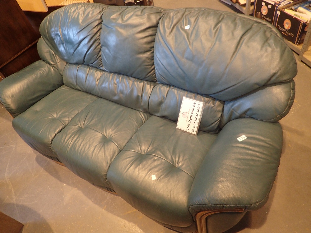 Three seat green leather settee