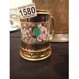 Sandland ware floral decorated tankard