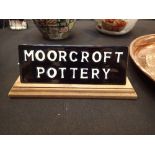 Moorcroft sign 1970's, on a wooden plint