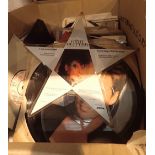 Box of mixed 45rpm records including Gary Glitter star shaped picture disc and Don Johnson picture