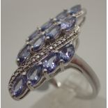 925 silver rhodium plated twelve stone lilac ring, possibly tanzanite,