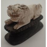 19thC carved Oriental ivory lion on plinth