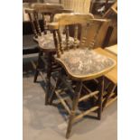 Pair of oak upholstered bar stools